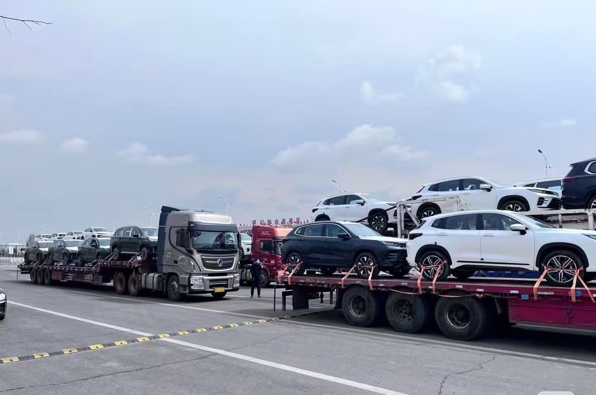 Multi-deck car carriers loaded with SUVs at the port